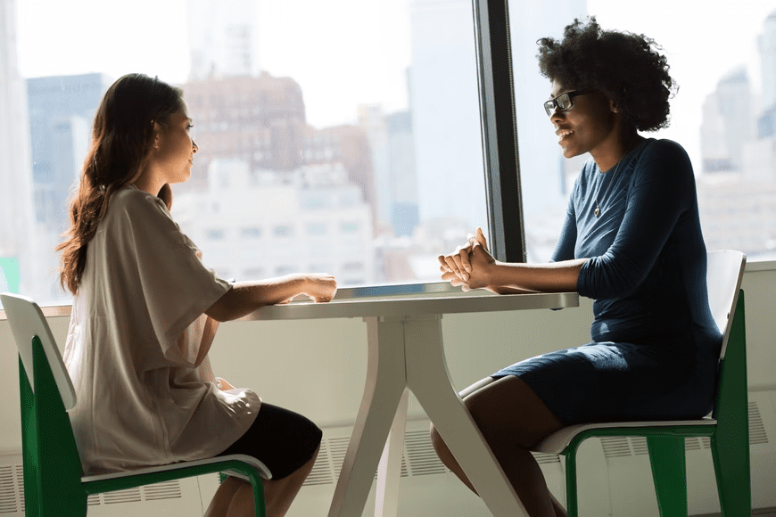 Two women in the middle of interview session.